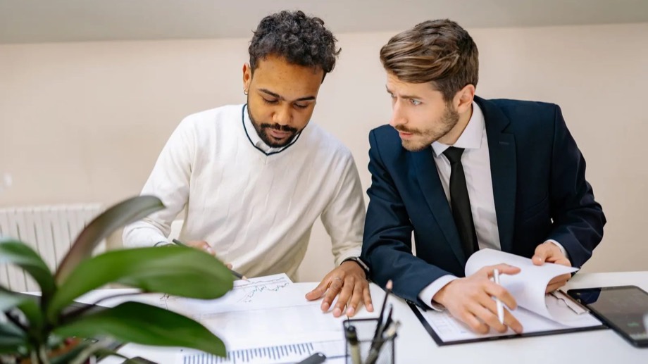 Two founders going through documents together